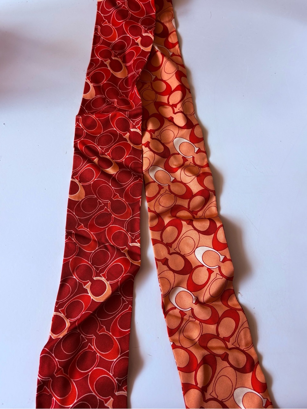 Coach Silk Patterned Scarf in Red and Orange